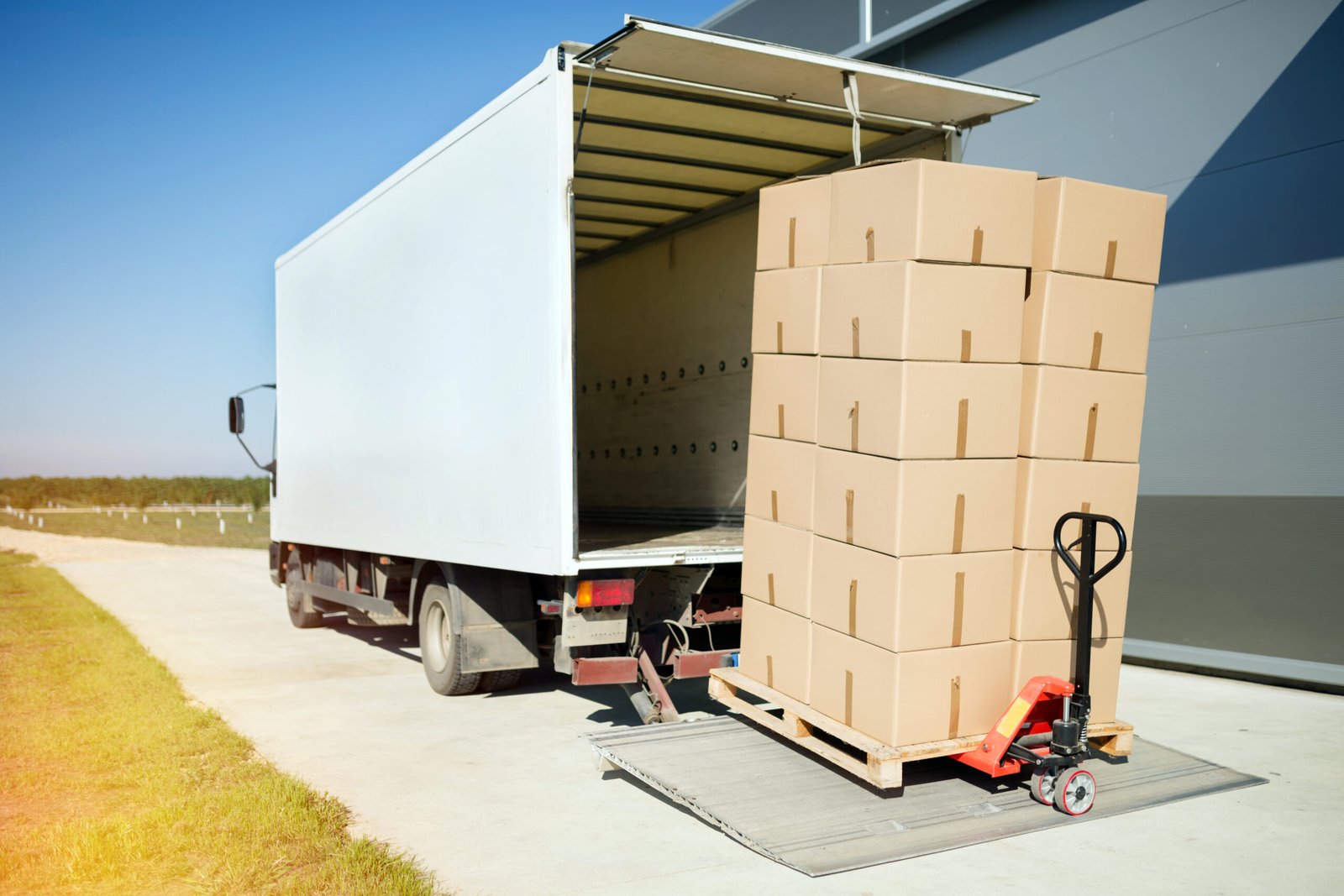 Truck transporting goods packed in boxes from warehouse