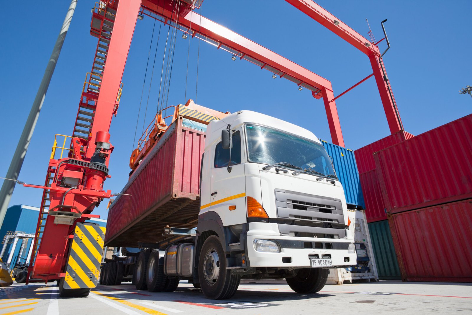 wide-low-angle-shot-of-a-container-being-placed-on-2026-03-26-08-17-05-utc